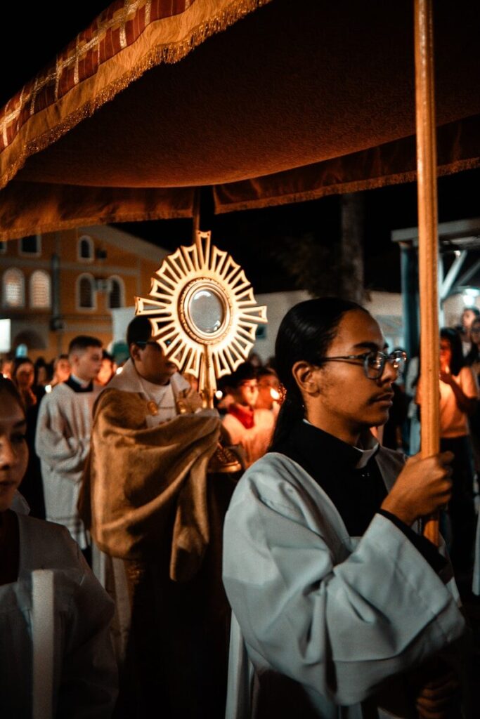 Religious procession with a monstrance at night